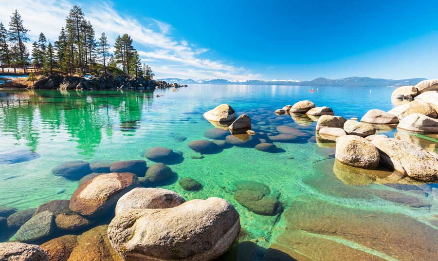 View of the clear water from the rocky shoreline of Lake Tahoe