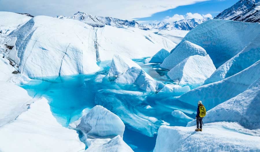A hiker admiring the view in Matanuska Glacier