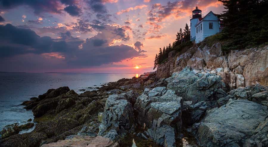 Colorful sky over the Bass Harbor Head Light Station during sunset