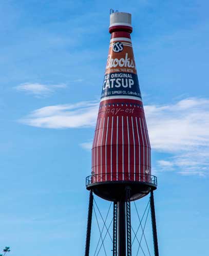The Brooks Catsup Bottle Water Tower under the clear blue sky