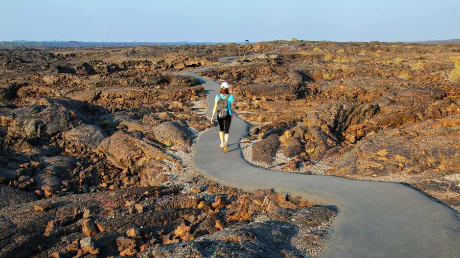 A woman walking at the Craters of the Moon National Monument in Idaho