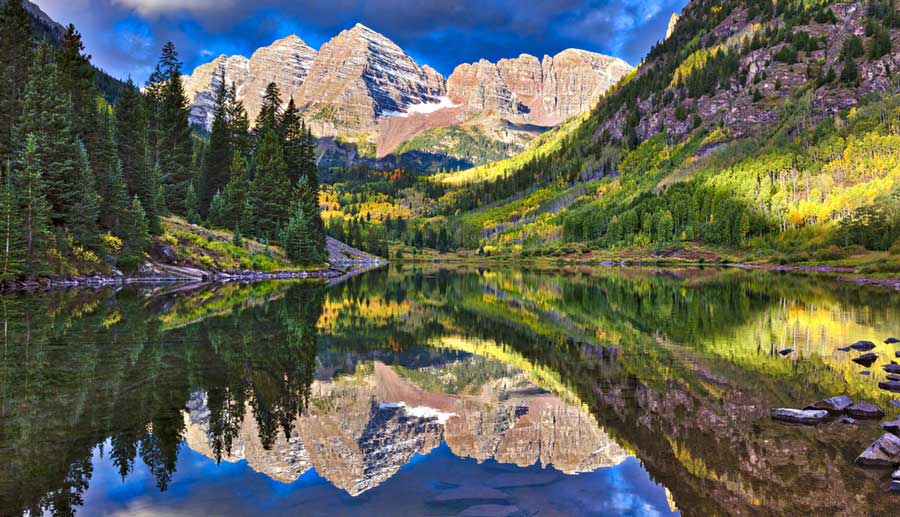 Scenic view of the Maroon Bells National Forest and its reflection on the water