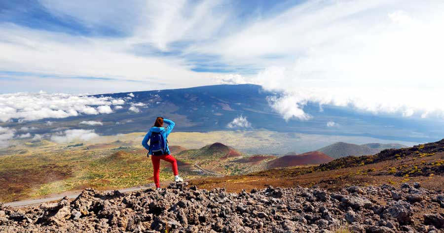 A woman admiring the view of Mauna Loa