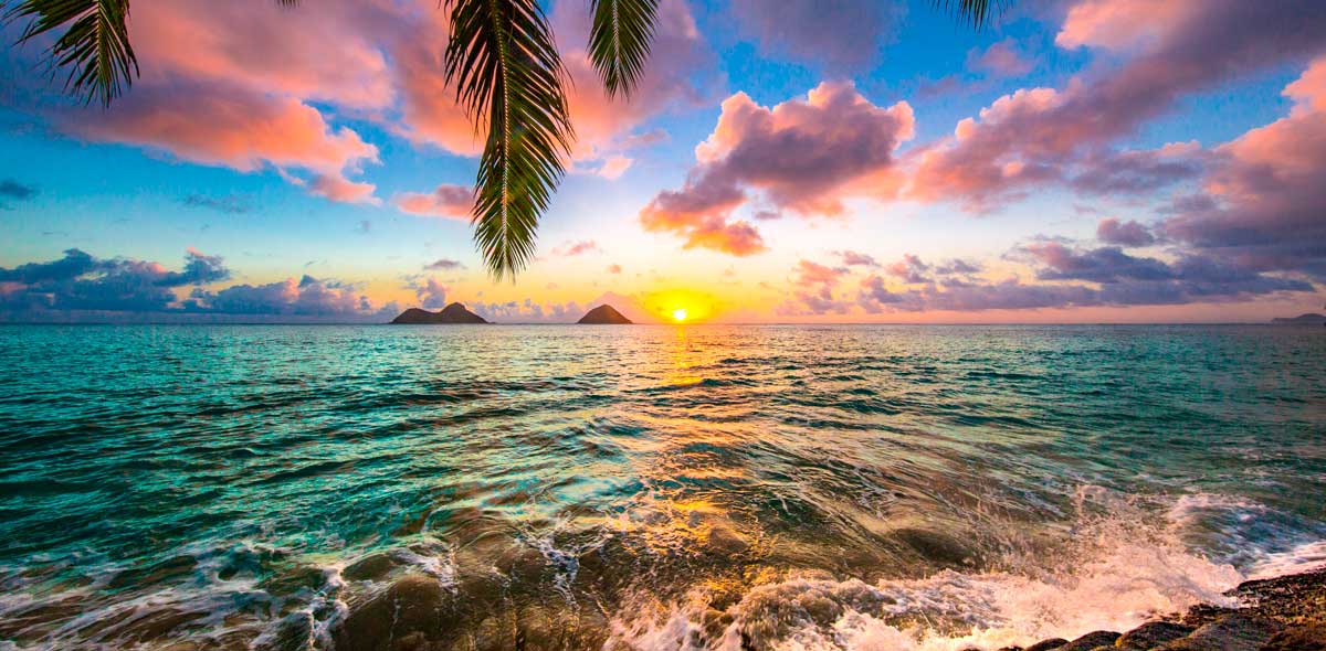 Colorful sky over Lanikai Beach during sunrise, one of the things Hawaii is known for