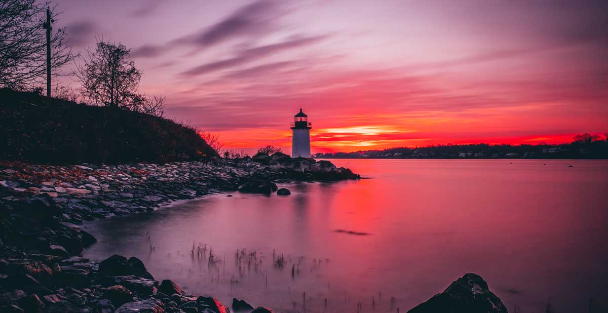 The Fort Pickering Lighthouse from afar during sunset, one of the things Massachusetts is known for