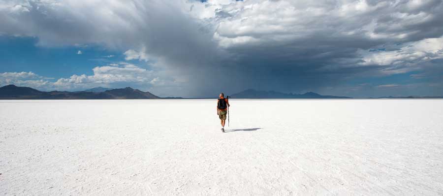 A man at the middle of Bonneville Salt Flats