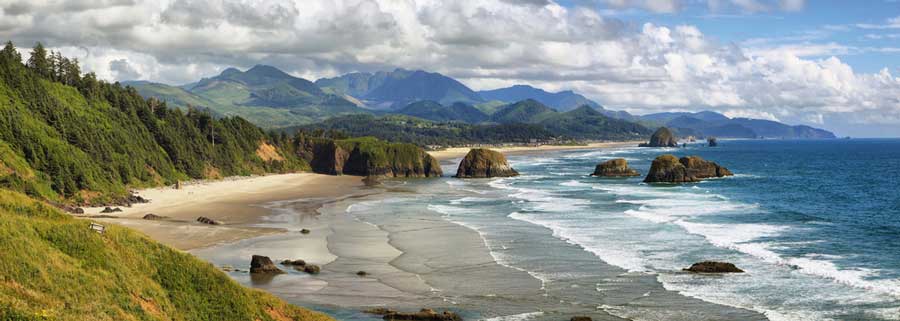 View of waves coming along the shore in Cannon Beach