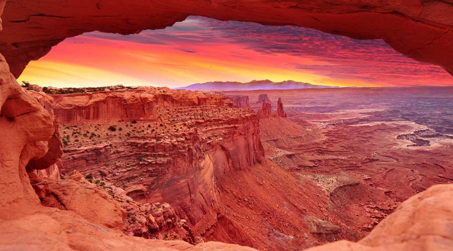 Scenic view of the sunrise in Mesa Arch at Canyonlands National Park