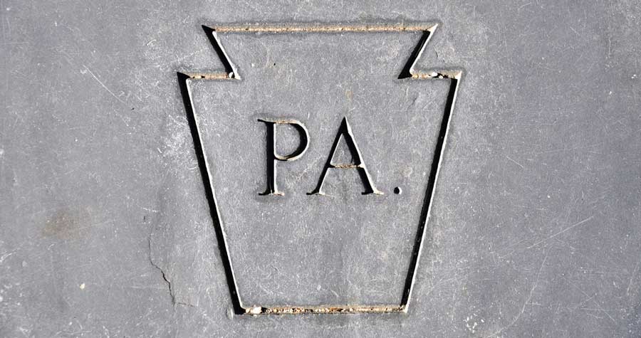 PA engraved into a stone in Pennsylvania