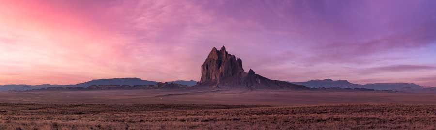 Scenic view of the Shiprock under the colorful sky in New Mexico