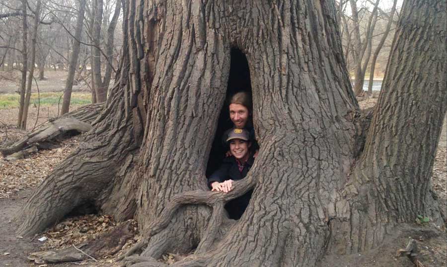 The author with a friend inside a tree on one of the State Parks in Minnesota
