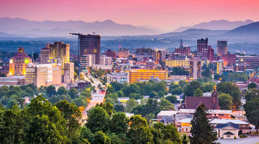 Aerial view of Asheville under the colorful sky during sunset