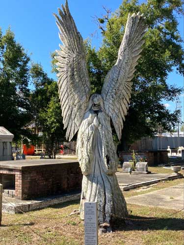 A dead tree in Bay St. Louis carved into an angel