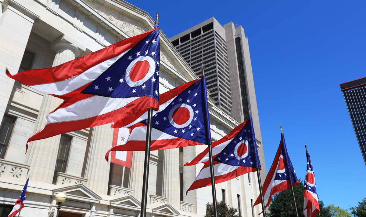 The Ohio state flags outside the Ohio Statehouse