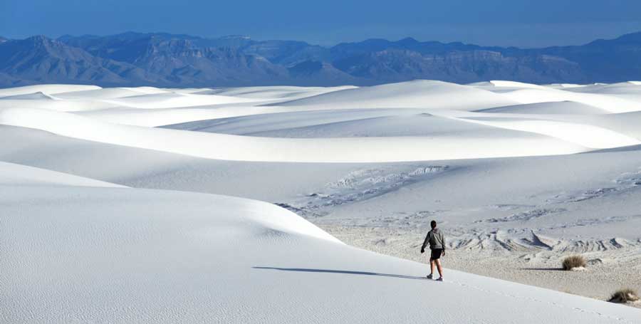 A man walking at the White Sands National Park