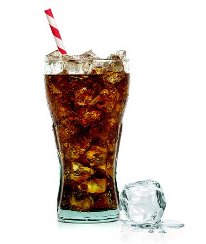 A glass of Coca-Cola with straw and an ice on the side