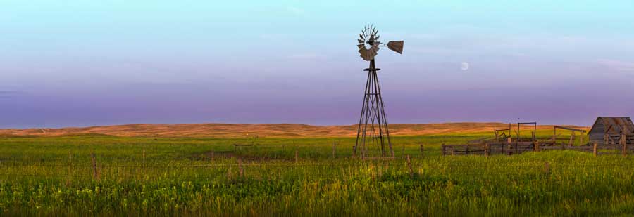 Colorful over a windmill on a field in Nebraska