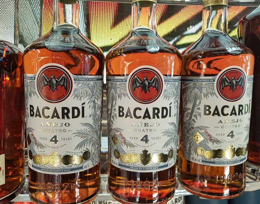 Bottles of Bacardi displayed on a shelf