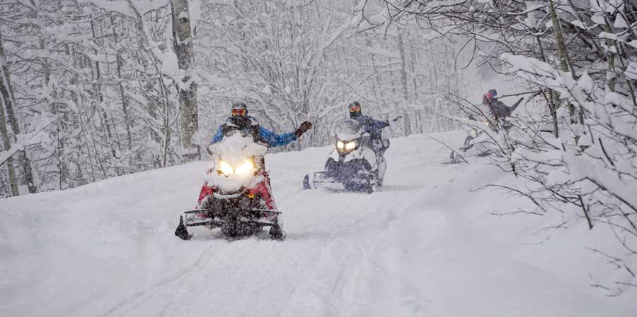 People riding snowmobiles in Wisconsin